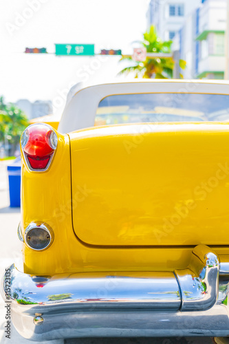 Tail Light of a Yellow Classic American Car in South Beach, Miami, Florida.