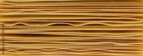 Obraz  z motywem Uncooked Italian pasta lasagne background and texture, top view
