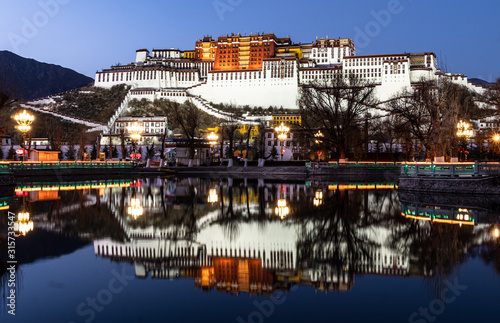 Stunning twilight over the famous Potala Palace in Lhasa old town in Tibet, China photo