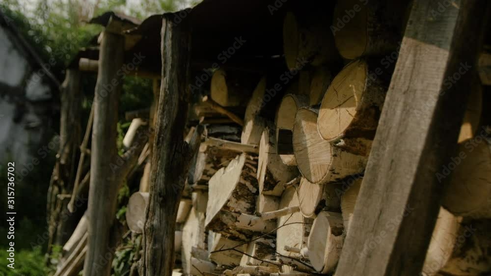Village landscape in summer, wood for the bath Village landscape in summer, wood for the bath