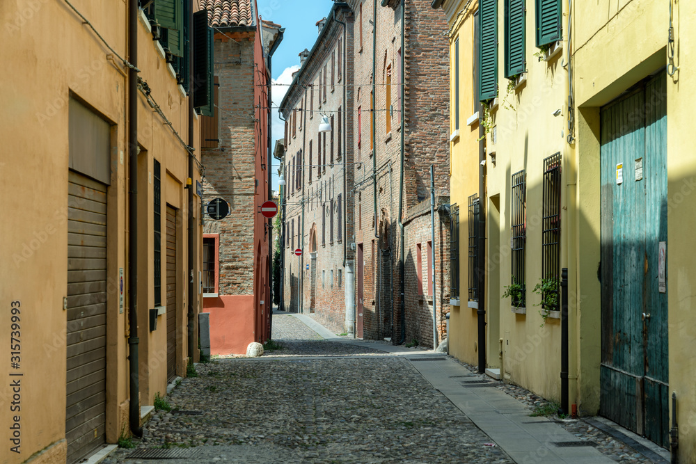 Narrow medieval street in Ferrara, Italy