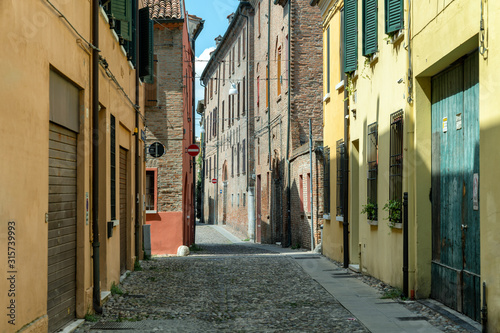 Fototapeta Naklejka Na Ścianę i Meble -  Narrow medieval street in Ferrara, Italy