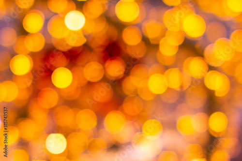 Gold yellow and red abstract background with bokeh defocused blurred lights