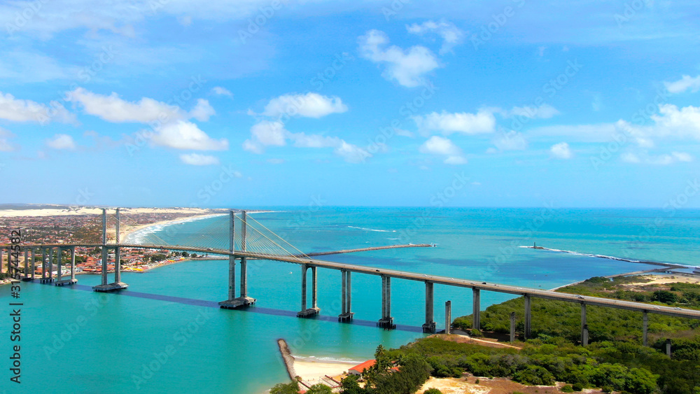 Suspension Bridge in Natal, Brazil and colorful blue water of Atlantic ocean. 