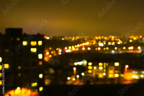 Blurred night city lights photo. Abstract pattern background in bokeh effect.