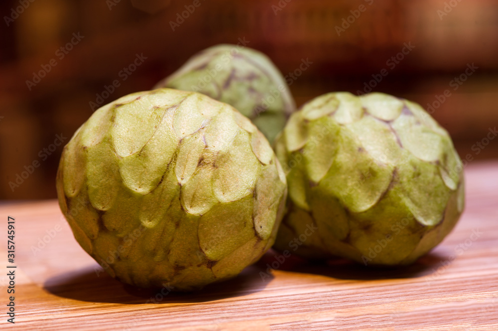 Obraz premium sale of exotic cherimoya fruits, still life on the market