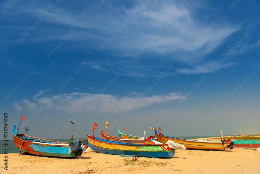Fishing boats on the Varkala beach in south india Fishing boats on the Varkala beach in south india
