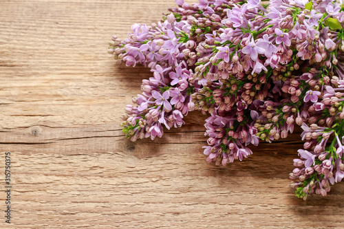 Lilac on wooden background