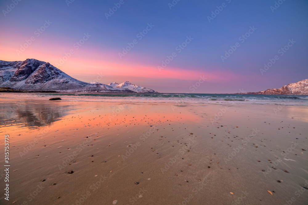 Amazing sunrise with amazing magenta color over sand beach. Tromso, Norway . Polar night. long shutter speed Amazing sunrise with amazing magenta color over sand beach. Tromso, Norway . Polar night. long shutter speed