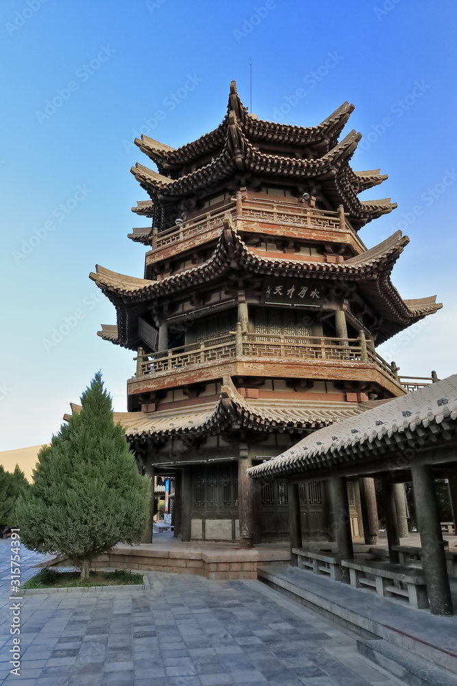Upturned eaves-tiered Chinese pagoda and surrounding pavilions overlooking Crescent Lake-Dunhuang-Gansu-China-0666 Upturned eaves-tiered Chinese pagoda and surrounding pavilions overlooking Crescent Lake-Dunhuang-Gansu-China-0666