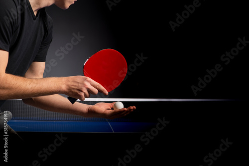 Portrait of young man playing tennis photo
