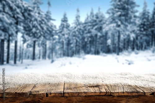 desk of free space and winter window background 