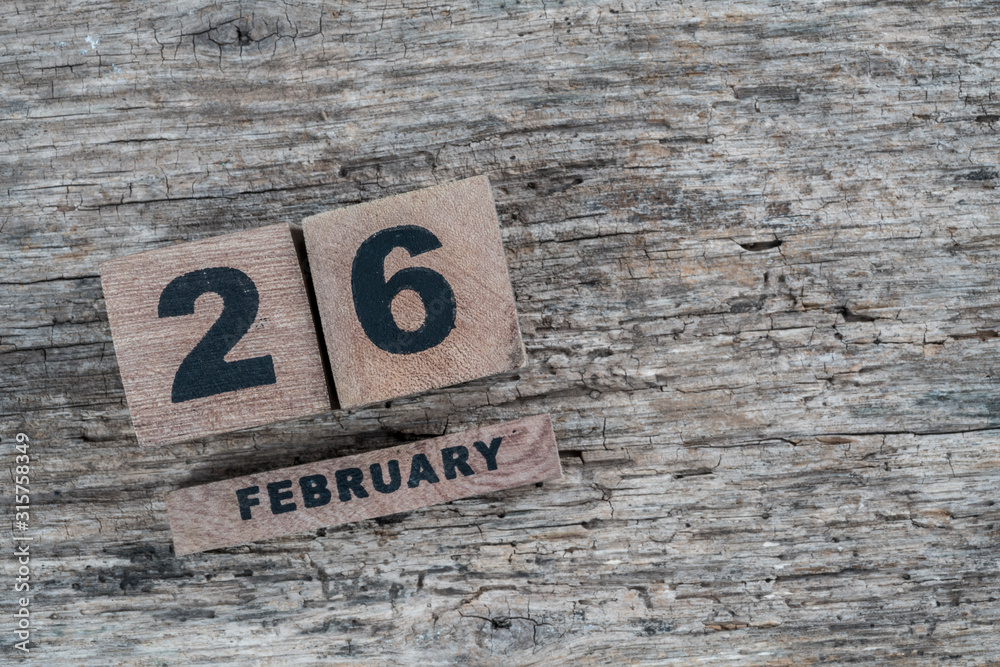 cube calendar for february on wooden background with copy space cube calendar for february on wooden background with copy space
