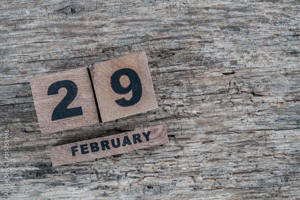 cube calendar for february on wooden background with copy space cube calendar for february on wooden background with copy space