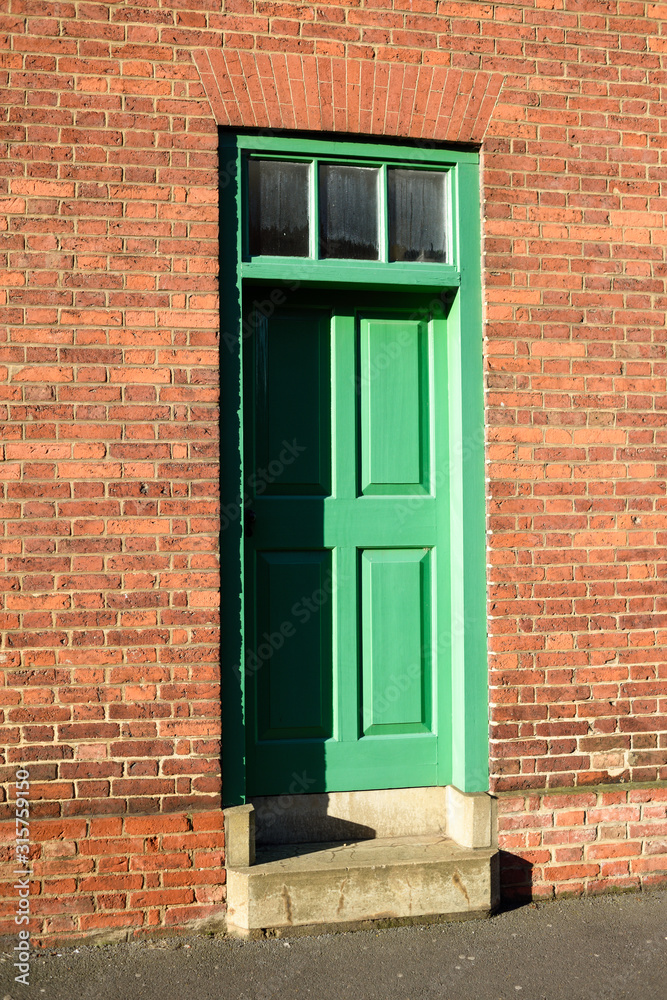 Green Door Entrance to Brick Built House Green Door Entrance to Brick Built House