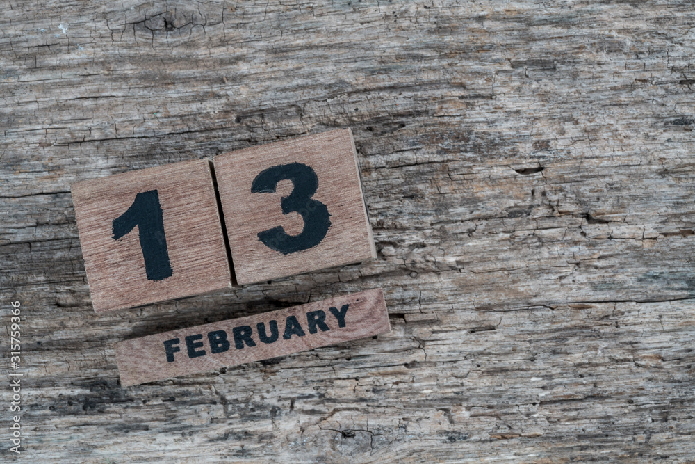 cube calendar for february on wooden background with copy space cube calendar for february on wooden background with copy space