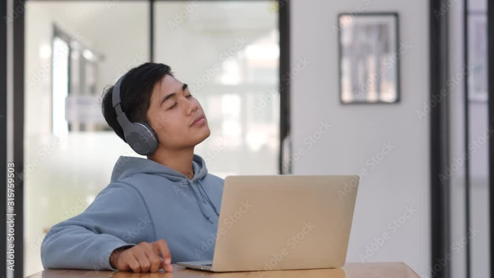 Enjoying and relaxing his favorite music. Enjoying and relaxing his favorite music.