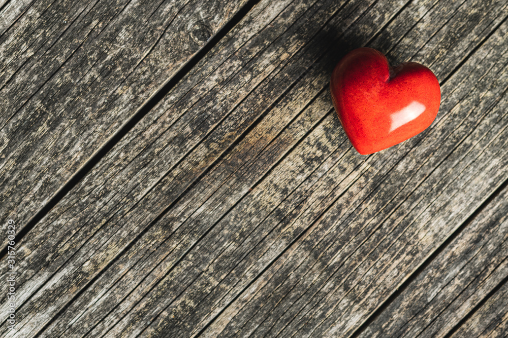 Red heart on old wooden table. Red heart on old wooden table.
