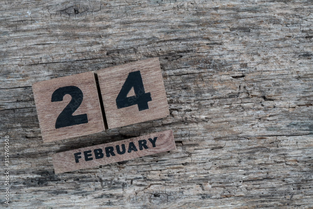 cube calendar for february on wooden background with copy space cube calendar for february on wooden background with copy space
