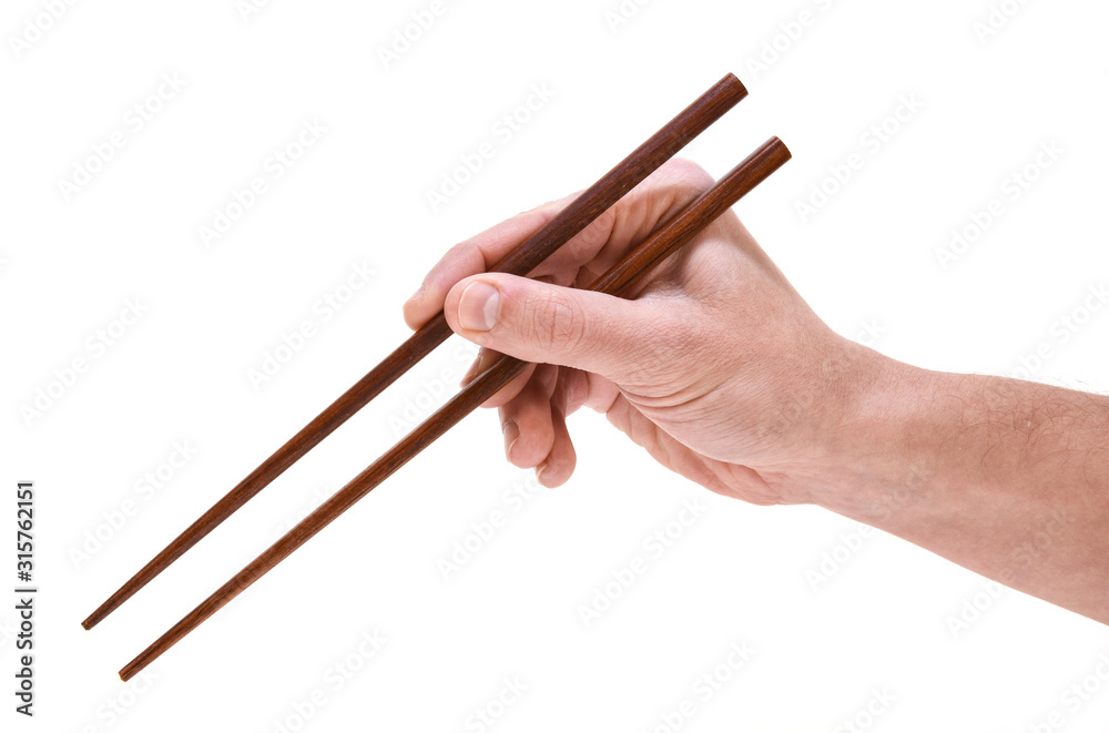 hand holding chopsticks isolated on white hand holding chopsticks isolated on white
