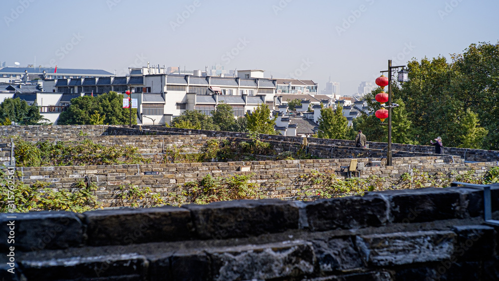 chinese small town in front of a city wall