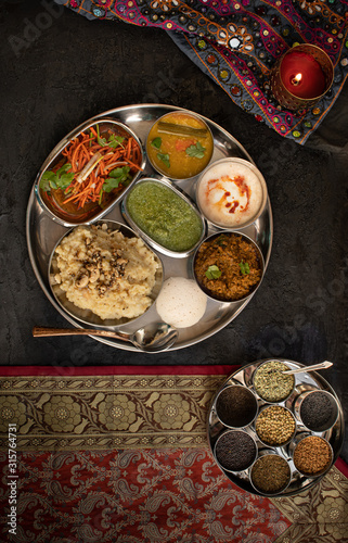 South Indian vegetarian thali with pongal, sambar, chutney and side dishes