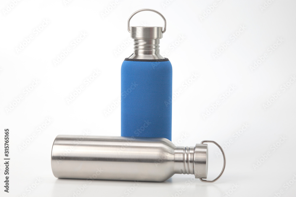 metal steel water flasks on white background. metal drinking utensils