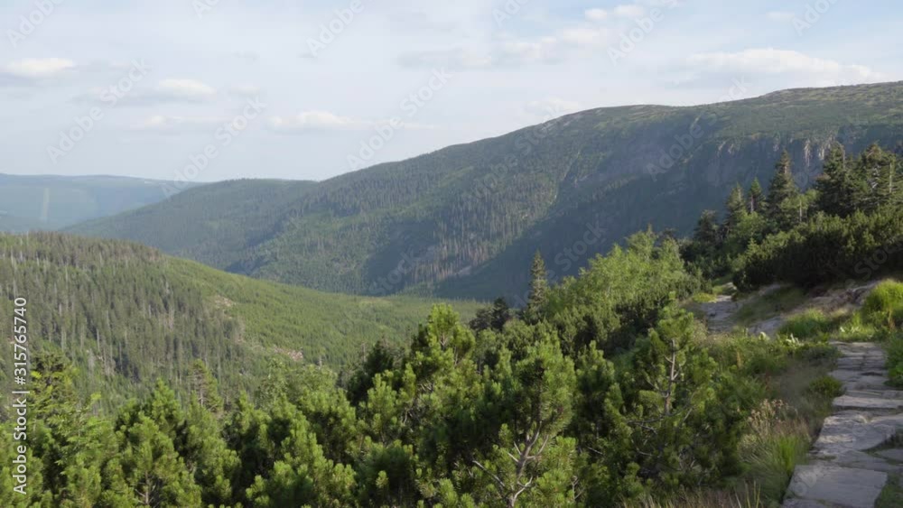 Nature with a rocky pathway which overlooks a view of nature and mountains. Nature with a rocky pathway which overlooks a view of nature and mountains.