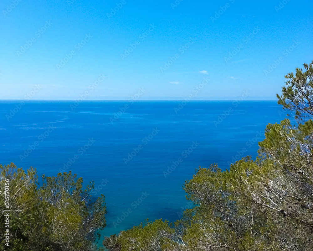 Clear blue sky on the Mediterranean Sea with wide open horizon