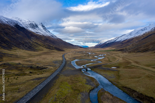 road in the mountains with a river in Iceland