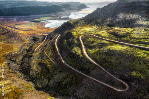 serpentine road in the mountains of Iceland aerial view