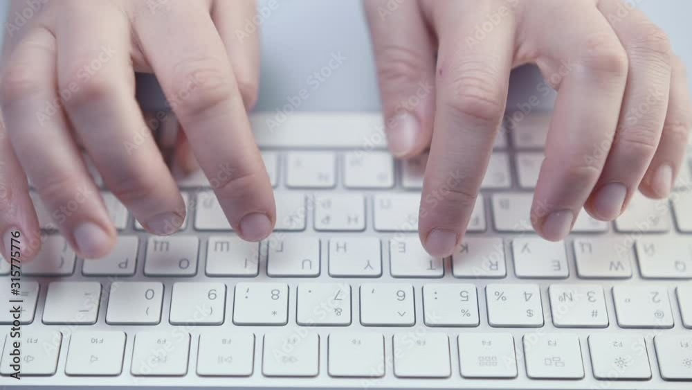 Woman office worker typing on the keyboard Woman office worker typing on the keyboard