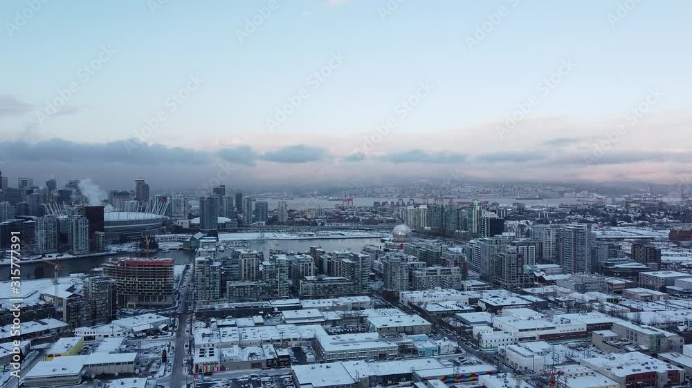 Roofs with the snow and mountains on the background during sunset in Vancouver Roofs with the snow and mountains on the background during sunset in Vancouver