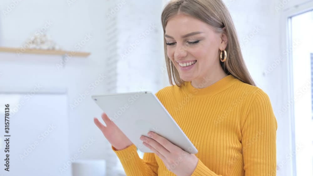 Happy Young Creative Female Designer using Tablet Happy Young Creative Female Designer using Tablet