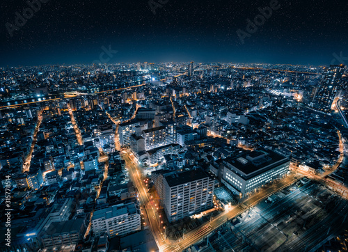 Fotografie Aerial Drone View of Futuristic City Skyline with Starry Night Sky in Tokyo, Jap