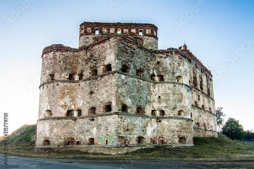 Medzhybizh castle with sunset rays  in Khmelnytskyi Oblast, Ukraine photo