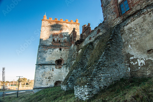 Medzhybizh castle with sunset rays  in Khmelnytskyi Oblast, Ukraine photo