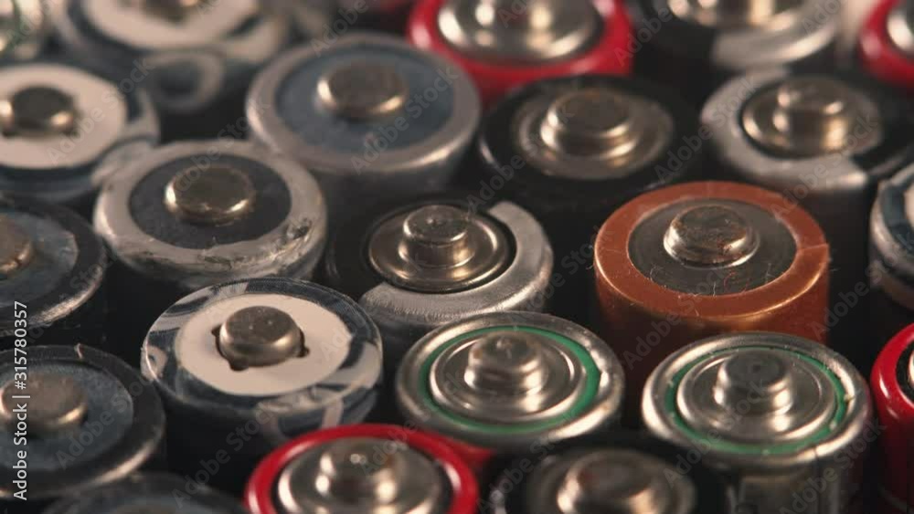 Rotating used batteries. Disposal of batteries. Battery recycling. Waste sorting Rotating used batteries. Disposal of batteries. Battery recycling. Waste sorting