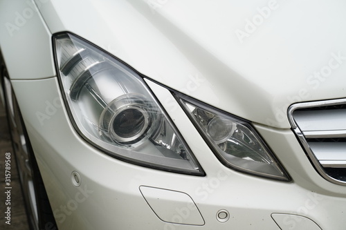 Car's headlamp detail © Sista