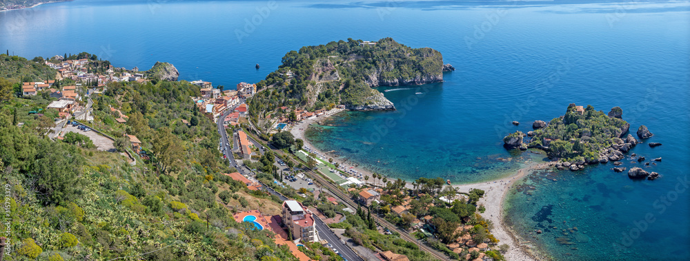 Taormina - The sicilian coastline with the beautifull little island Isola Bella.
