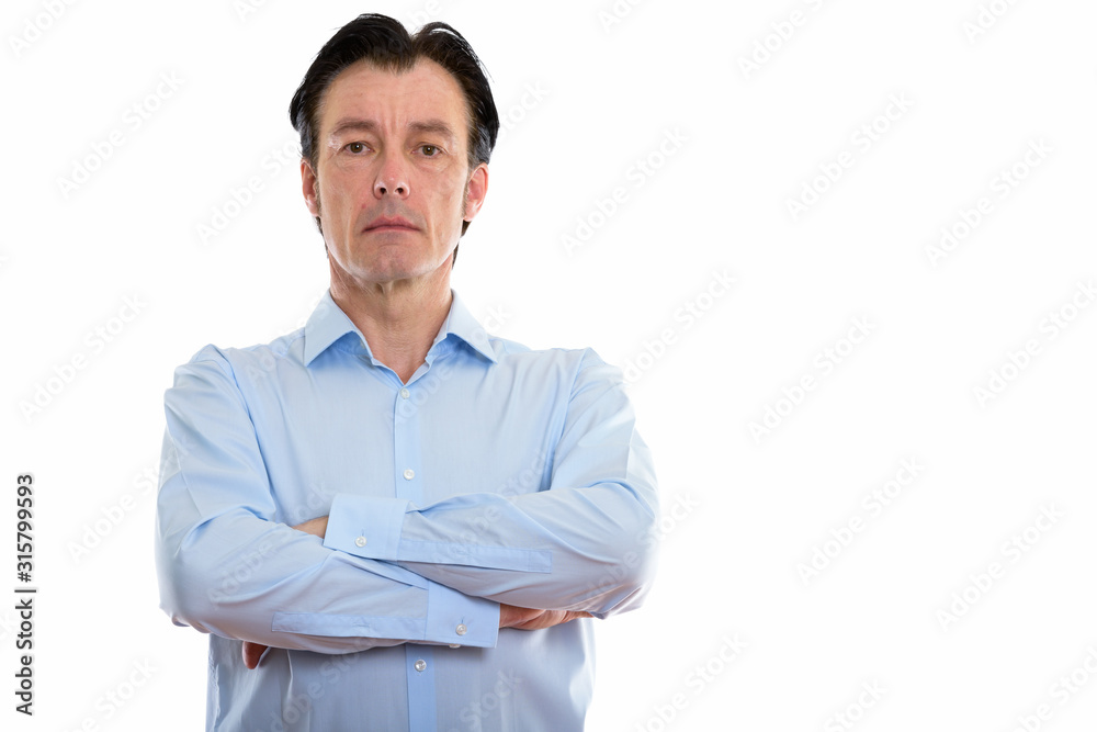 Studio shot of mature handsome businessman with arms crossed Studio shot of mature handsome businessman with arms crossed