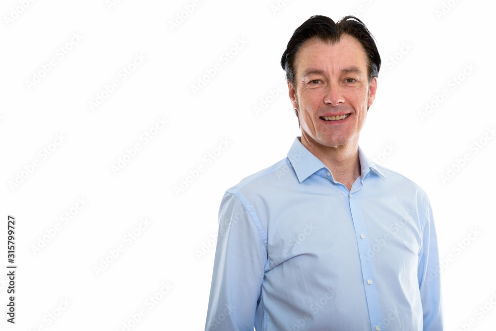 Studio shot of mature happy businessman smiling Studio shot of mature happy businessman smiling