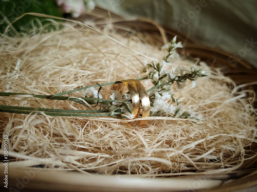 inspirational image of golden rings with wood fiber background