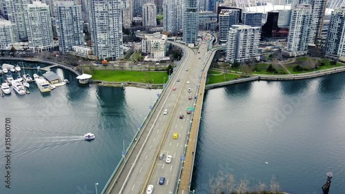 Bridge over Frazer creek with the traffic and Vancouvers downtown view photo