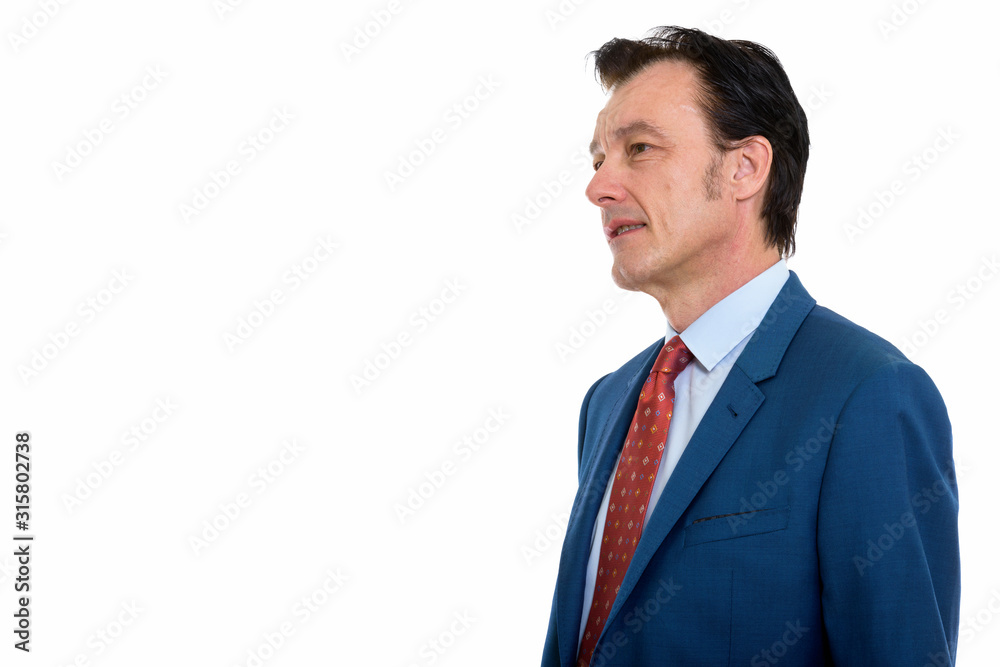 Profile view of mature handsome businessman in suit Profile view of mature handsome businessman in suit