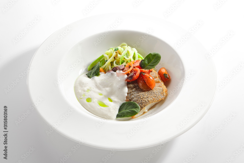 Cod Fillet in Cream Sauce with Vegetable Spaghetti Isolated Cod Fillet in Cream Sauce with Vegetable Spaghetti Isolated