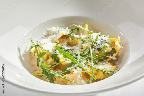 Tortellini with 4 Cheeses on White Restaurant Plate Isolated