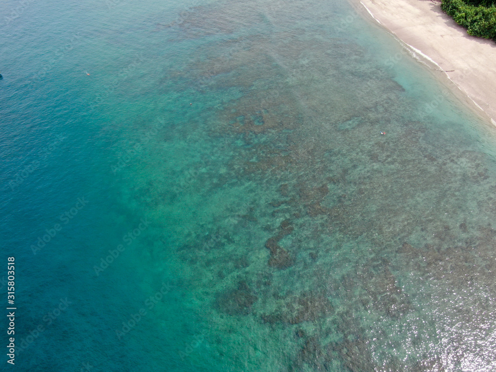 Shallow coral reef in the ocean from a drone