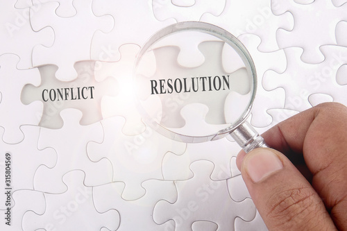 Magnifying glass searching missing puzzle 