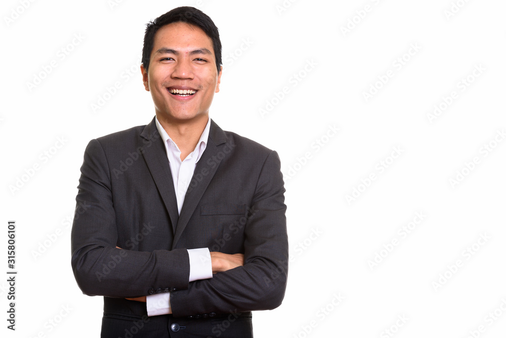 Studio shot of young Asian businessman with arms crossed Studio shot of young Asian businessman with arms crossed